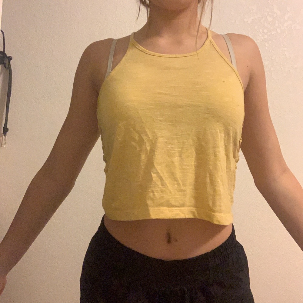 yellow crop top w/ designs on the sides
